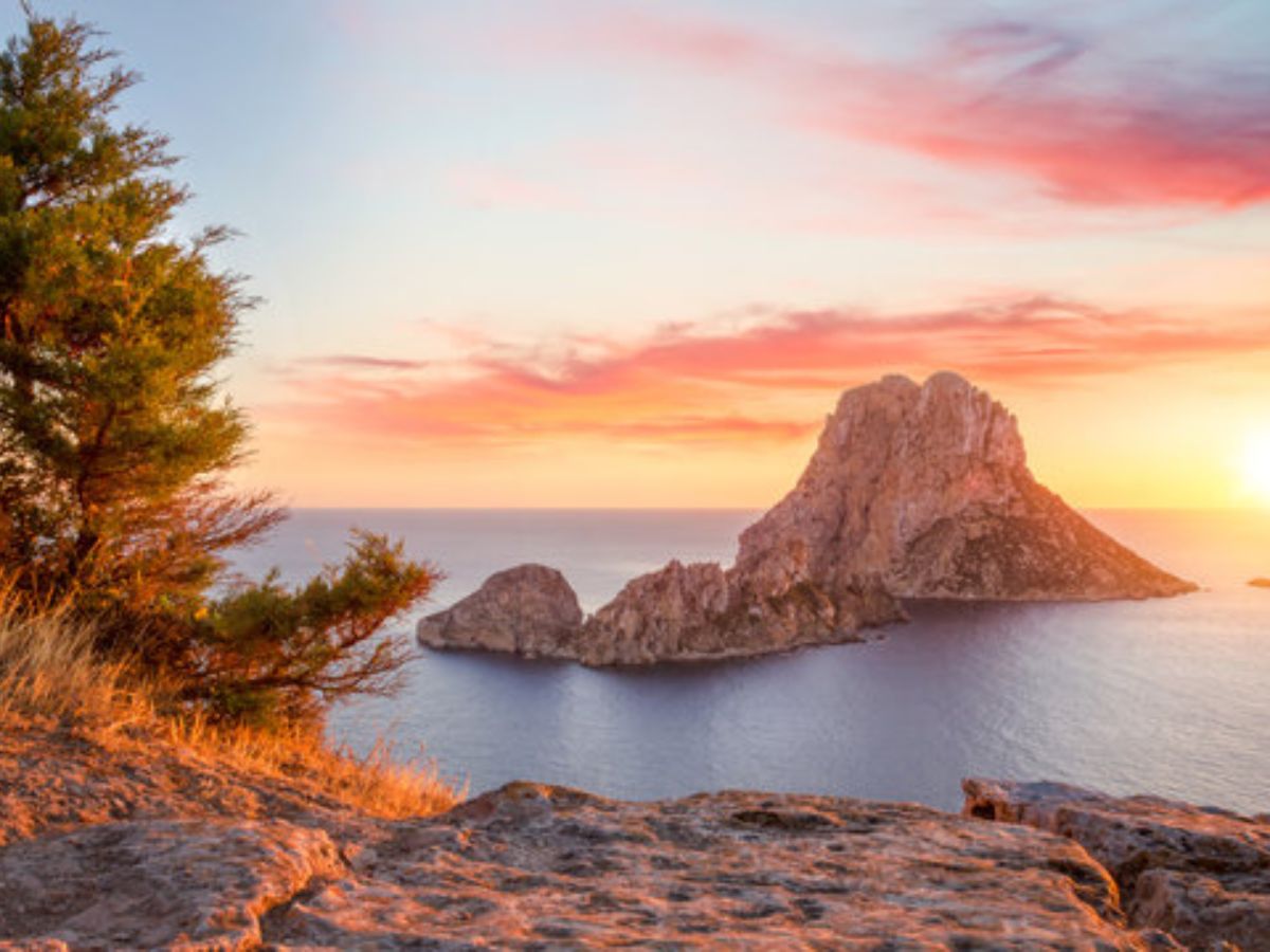 Es Vedrà Ibiza — mysterious rock rising from the Mediterranean at sunset